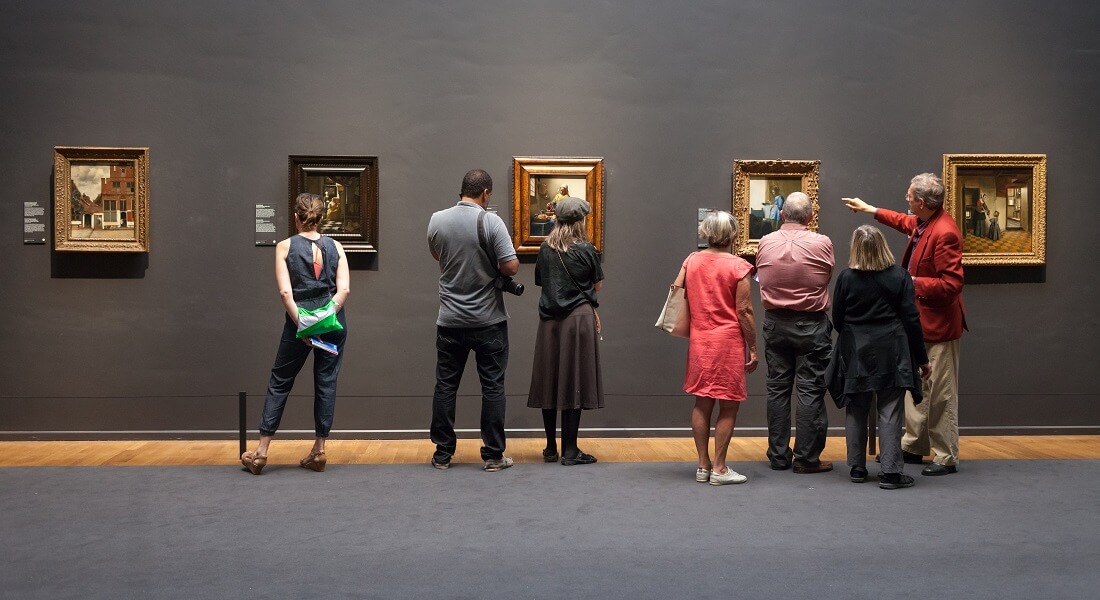 People looking at art in museum
